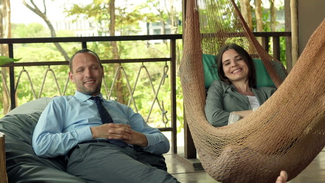 Portrait of happy, successful business couple on terrace
