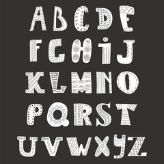 Doodle alphabet on black background. Cute hand drawn letters
