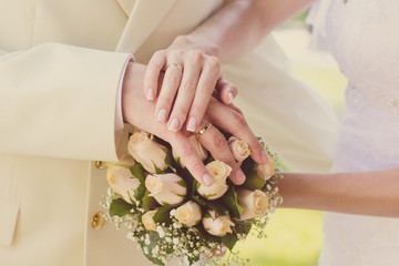 Bride and groom's hands with wedding rings,wedding day