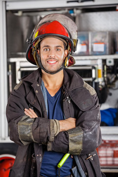 Smiling Firefighter Standing Arms Crossed