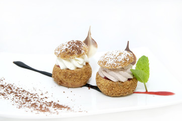 profiteroles with vanilla ice cream decorated with chocolate mint