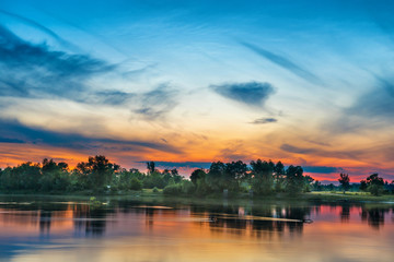 Fototapeta premium Beautiful sunset above a big river