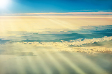 View from a plane to sunset on the sky
