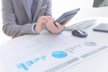 Businessman analyzing investment charts with computer. Accountin