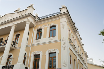 Fototapeta na wymiar Old building with balconies and sculptures in Yaroslavl