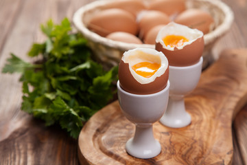 Boiled eggs on a wooden background