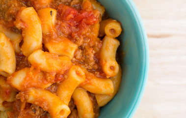 Beef and Macaroni in a small bowl close top view