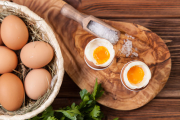 Boiled eggs on a wooden background