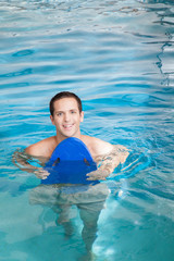 Man inside the pool with floater