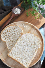 two wheat bread on wooden plate