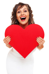 Young woman holding red paper heart