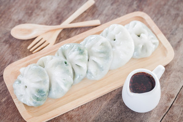 Chinese leek steamed dessert on wooden table