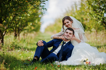 Loving wedding couple at the garden