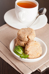Coconut butter cookies with cup of tea