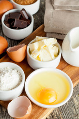 prepared baking ingredients on wooden table