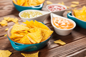 Plate of nachos with different dips