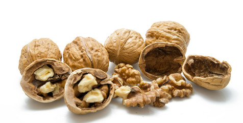 walnut and a cracked walnut on the white background