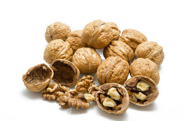 walnut and a cracked walnut on the white background