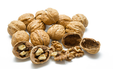 walnut and a cracked walnut on the white background