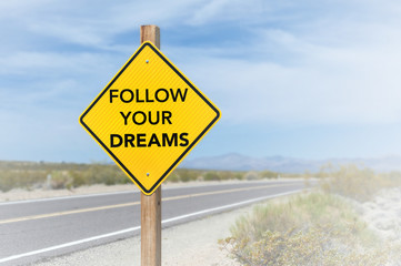 Follow your dreams road sign