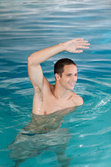 Man exercising in the pool