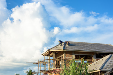 labor working in construction site for roof