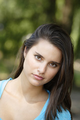 Fototapeta premium A beautiful woman looks at viewer.