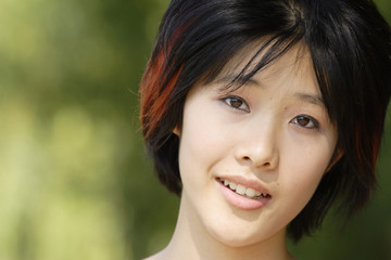 Fototapeta premium Beautiful woman looks at camera.
