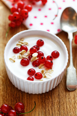 Natural yogurt with fresh red currants and grains