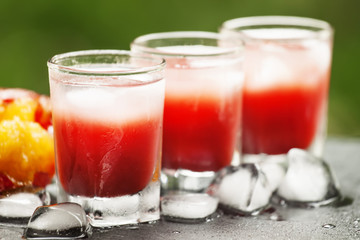 number of glasses of red cocktails on the veranda of a cafe on a