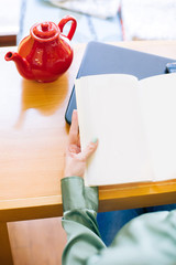 Girl reading blank book
