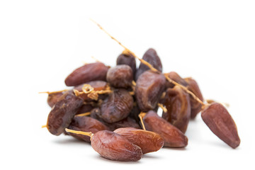 close up of dried dates  on white background