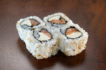 Sushis on wooden background