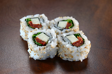 Sushis on wooden background