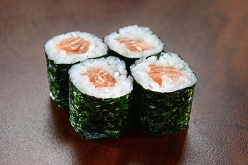 Sushis on wooden background