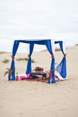 Wedding table arrangement in desert sand of Morocco stile 