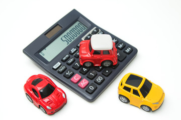 Toy car and calculator. Concept for finance and  insurance