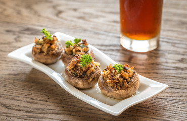 Mushrooms' caps stuffed with mixture of cheese, onion, breadcrum