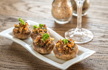 Mushrooms' caps stuffed with mixture of cheese, onion, breadcrum