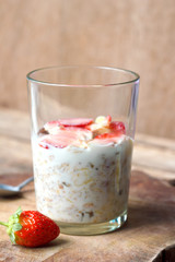 Crunchy musli (whole grain oats) served with fresh strawberries