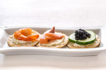 Canape with seafood on the plate