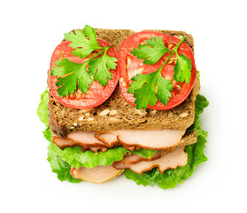 Sandwich with a ham and tomatoes