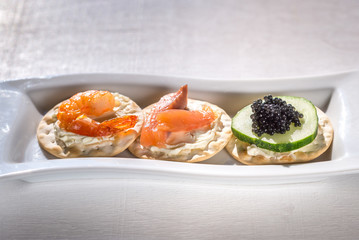 Canape with seafood on the plate