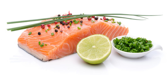 Fresh raw salmon fillet with herbs, lemon and spice