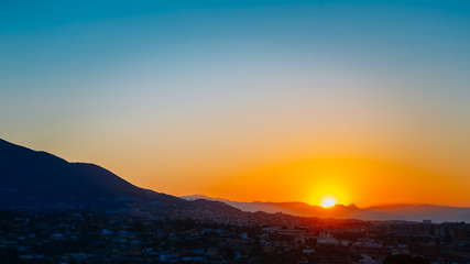Fototapeta premium Mountain And Sunset at Mijas, Spain. Dark Silhouette of Mountain