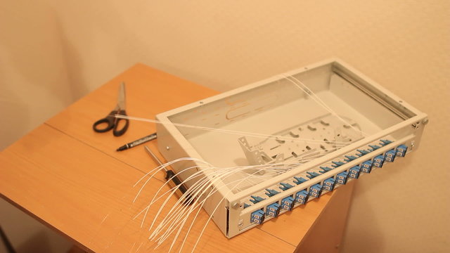 The technician connecting fiber optic on the telecom site