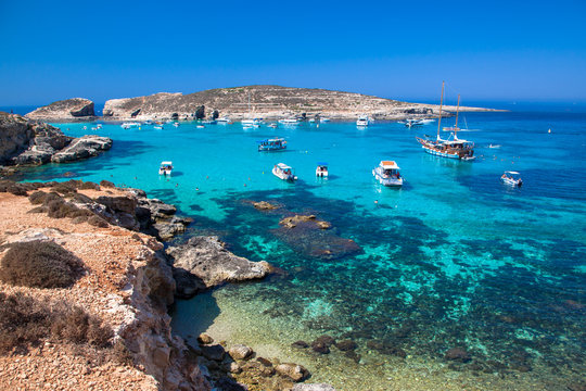 Fototapeta Yachts in blue lagoon at Comino - Malta