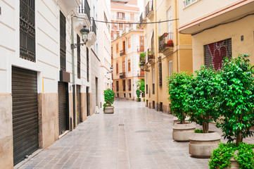 Fototapeta na wymiar Empty street in old town in Valencia, Spain