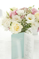 Menu card with beautiful flowers on table in wedding day