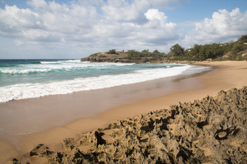 Very rustic and empty beach at the Indian Ocean in the coastal town Praia do Tofo in Inhambane, Mozambique
